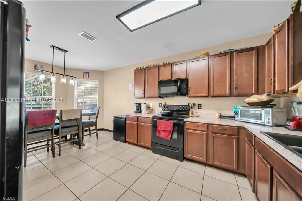10549 Canal Brook LN, Lehigh Acres, FL 33936 photo 6