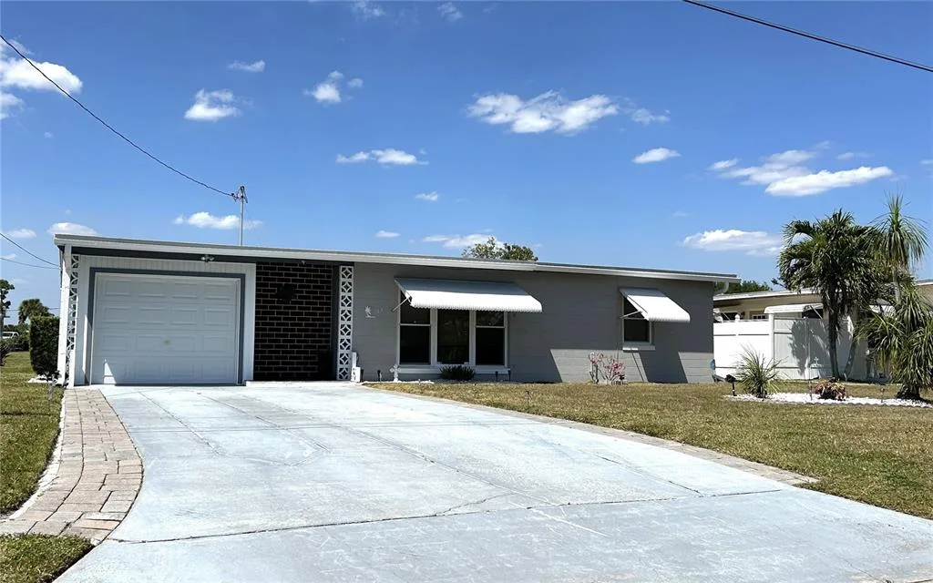123 POINSETTIA CIRCLE NE, PORT CHARLOTTE, FL 33952